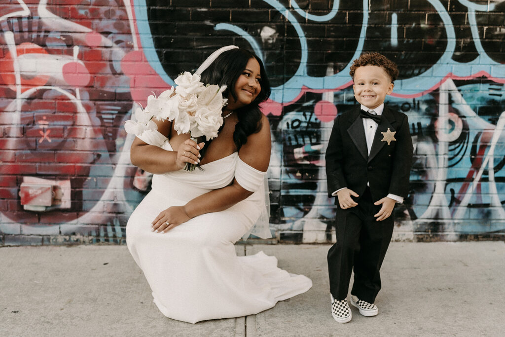 Bride with her nephew who is dressed up as "Ring Security."