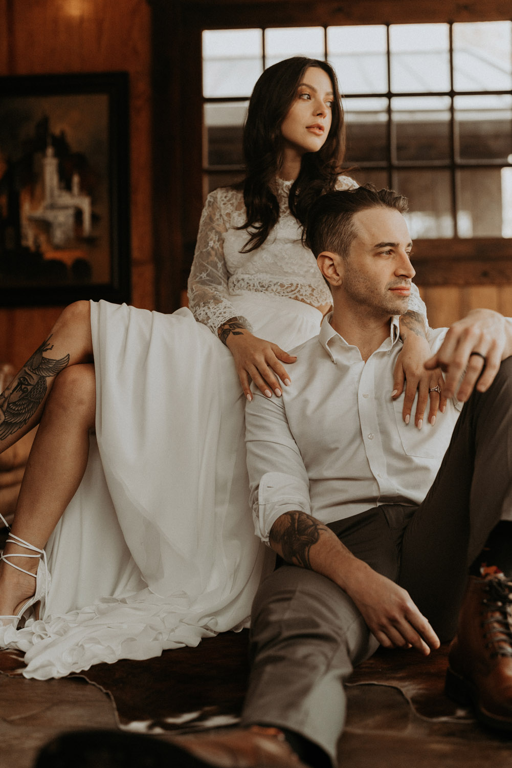 Western chic elopement in North Carolina. Bride and groom sitting together.