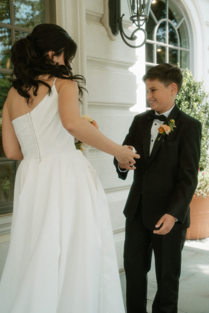 A bride's son reacts to seeing his mom for the first time on her wedding day.