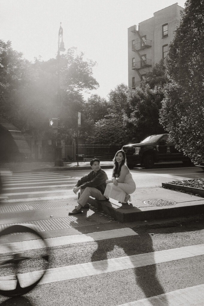 Artistic capture of couple and their shadows in black and white image shot in NY crosswalk