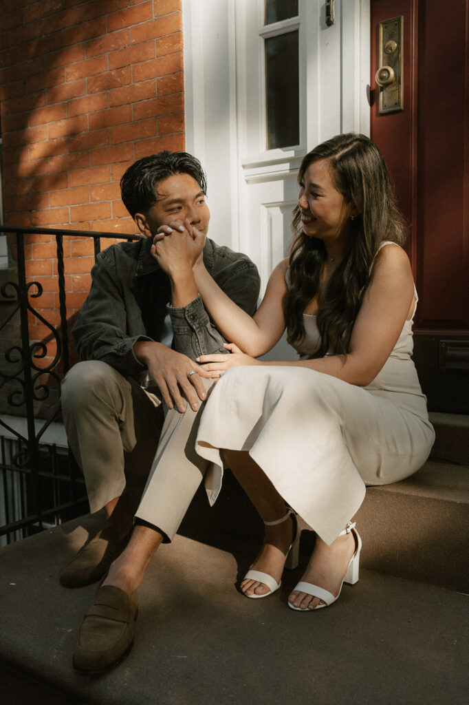 raw endearing moment with a cinematic vibe on the steps of a NY brownstone