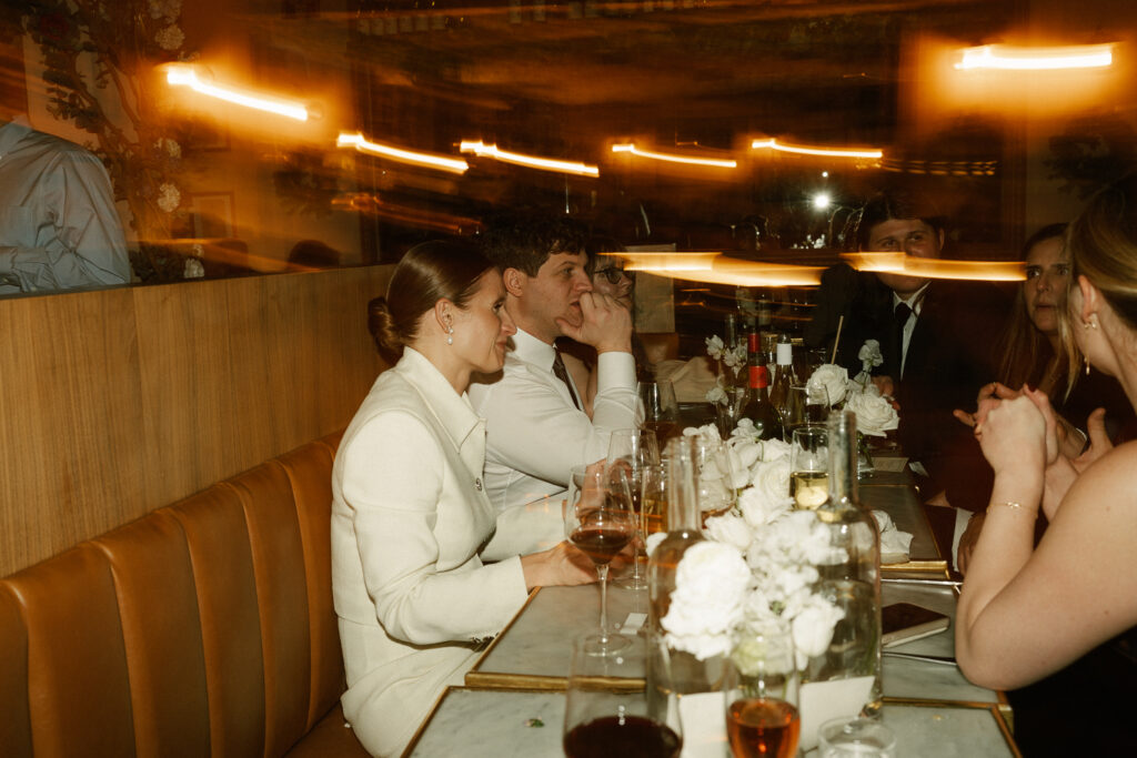 row of tables set up by Mino’s Brasserie staff to host intimate hybrid elopement dinner party