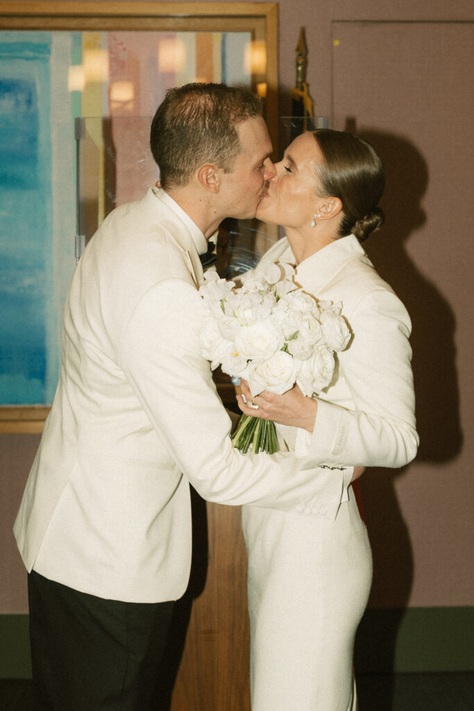 close up of married couple in cream colored winter elopement wear