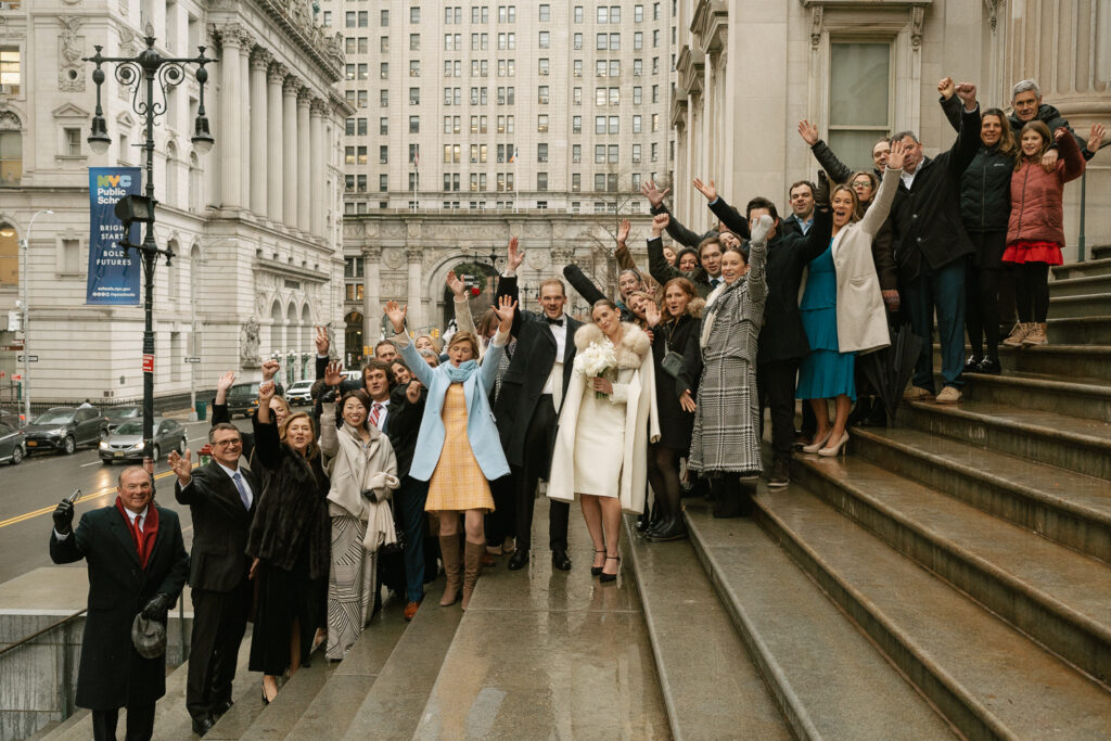 hybrid elopement group photo on steps of city hall on Worth St in Manhattan NY