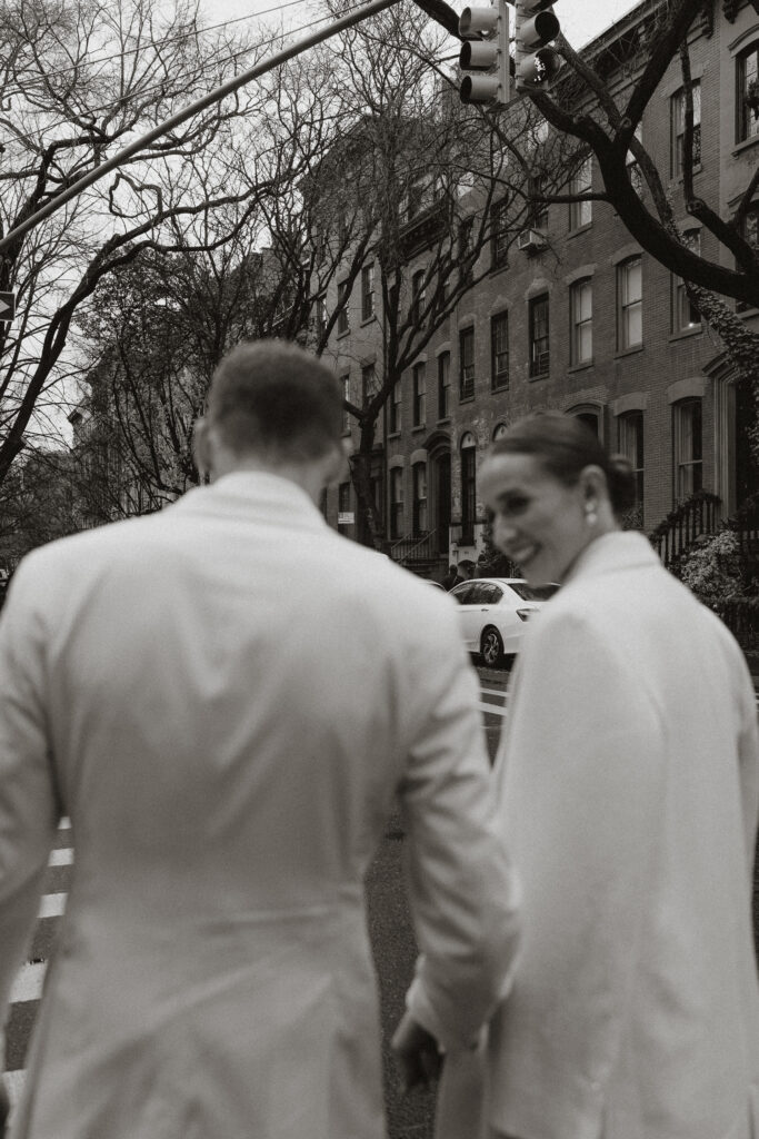 black and white image of husband and wife in streets of West Village NY