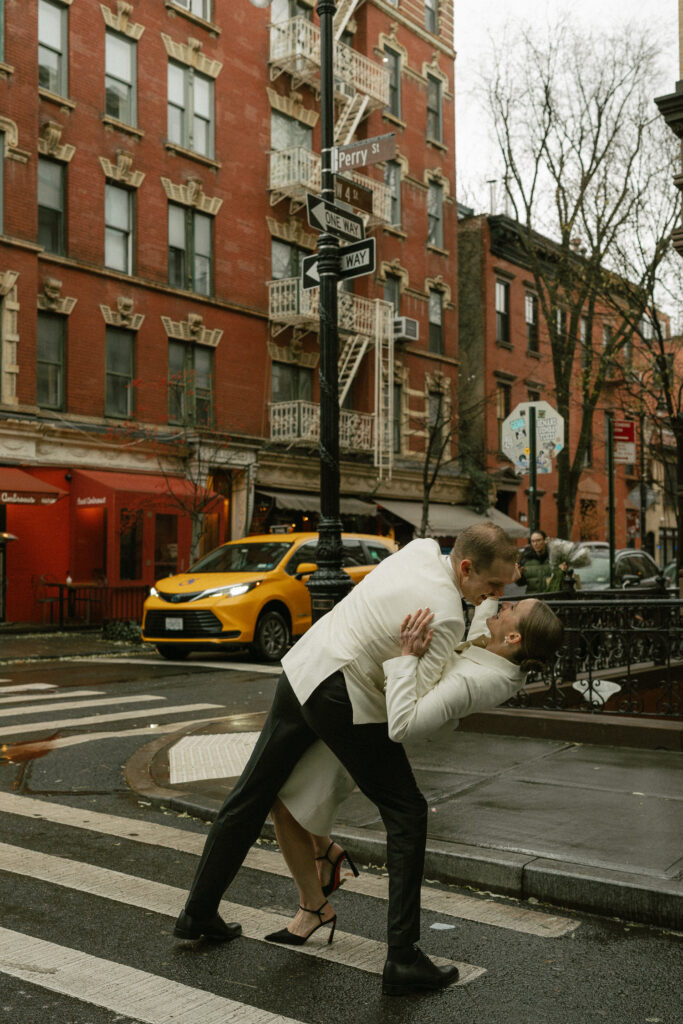 iconic dancing dip to celebrate just married status in crosswalk of Manhattan, NY 