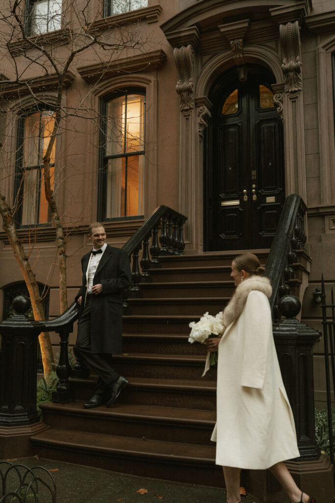 golden hour photo of wedding couple in front of a brownstone in the West Village