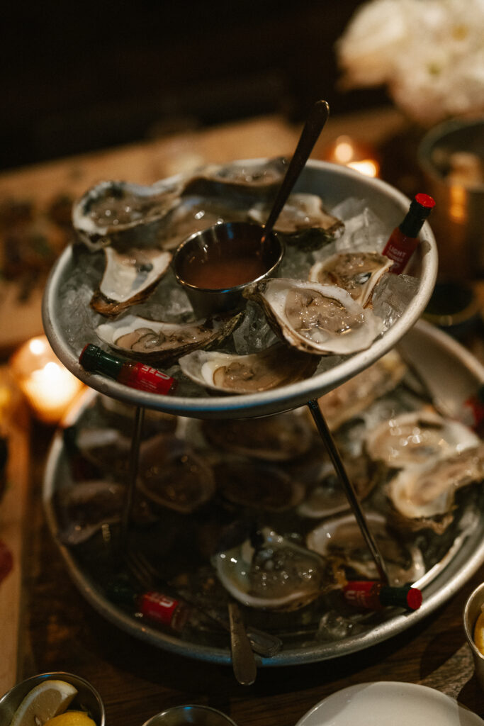 Oysters on the half shell being served a couples cocktail hour