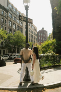 mid day photo shoot using sun to spotlight engaged couple