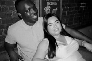 Black and White of engaged couple in NYPL