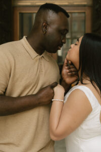 Romantic couple staring into each others eyes at library