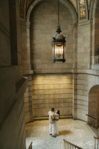 NYPL architecture encase engaged couple in photo shoot