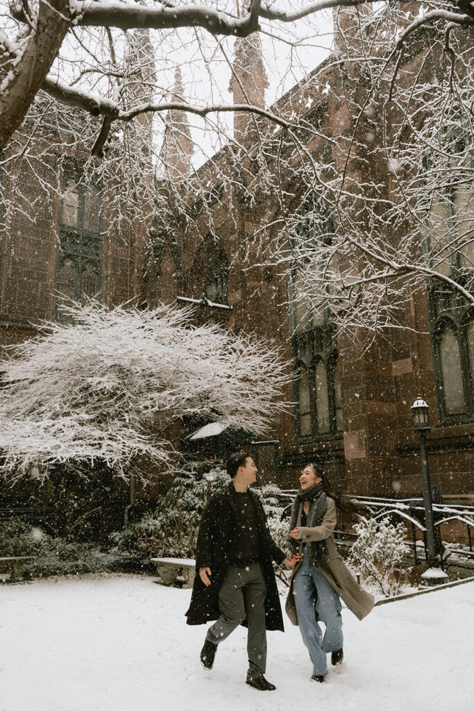 Snowy engagement photos in New York City with a cinematic style.