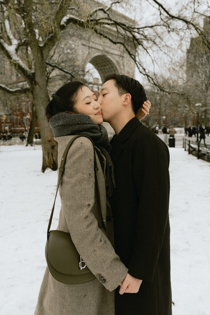 Couples photos in Washington Square Park after a snowfall.