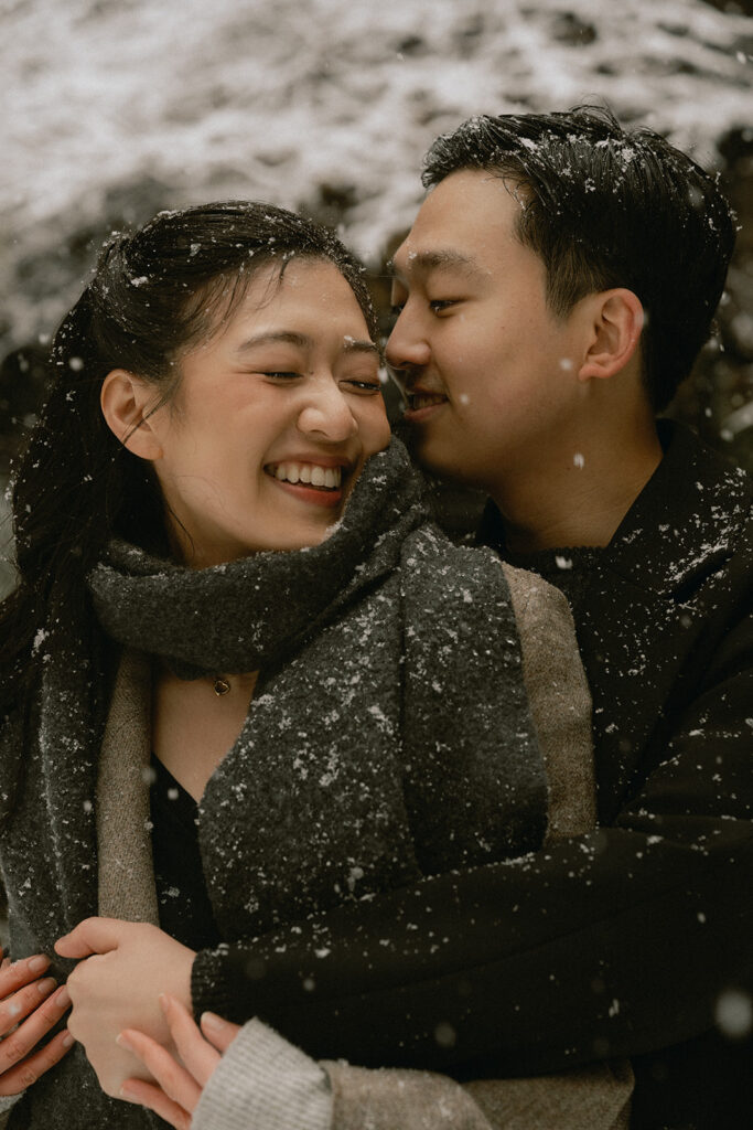 Snowy engagement photos in New York City with a cinematic style.