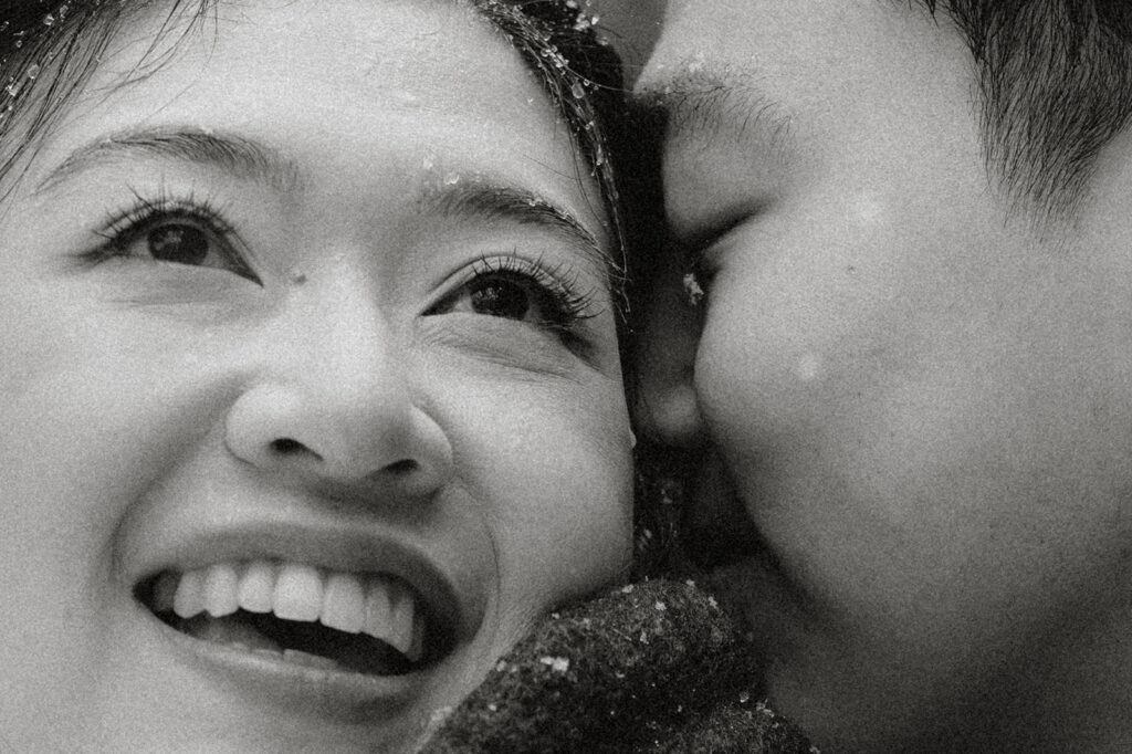 Snowy engagement photos in New York City with a cinematic style.