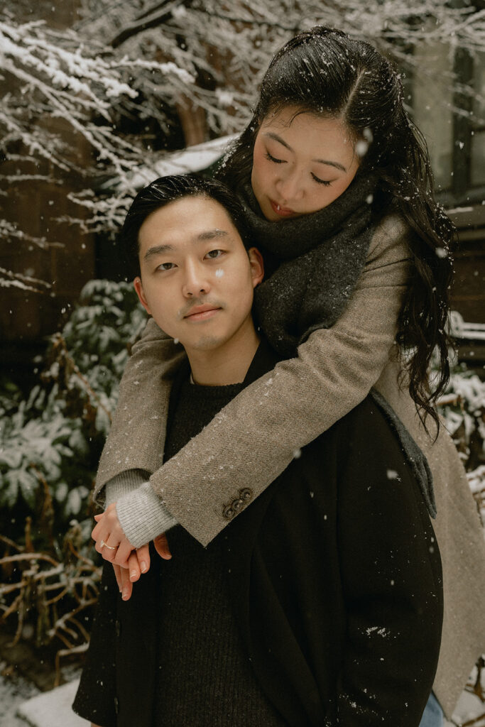 Snowy engagement photos in New York City with a cinematic style.