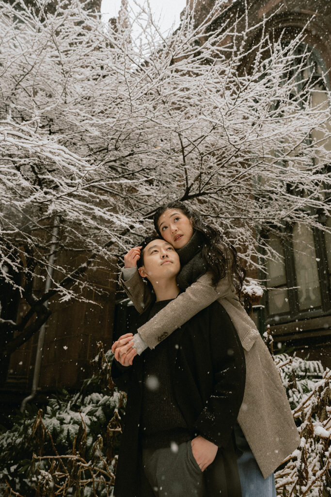 Snowy engagement photos in New York City with a cinematic style.