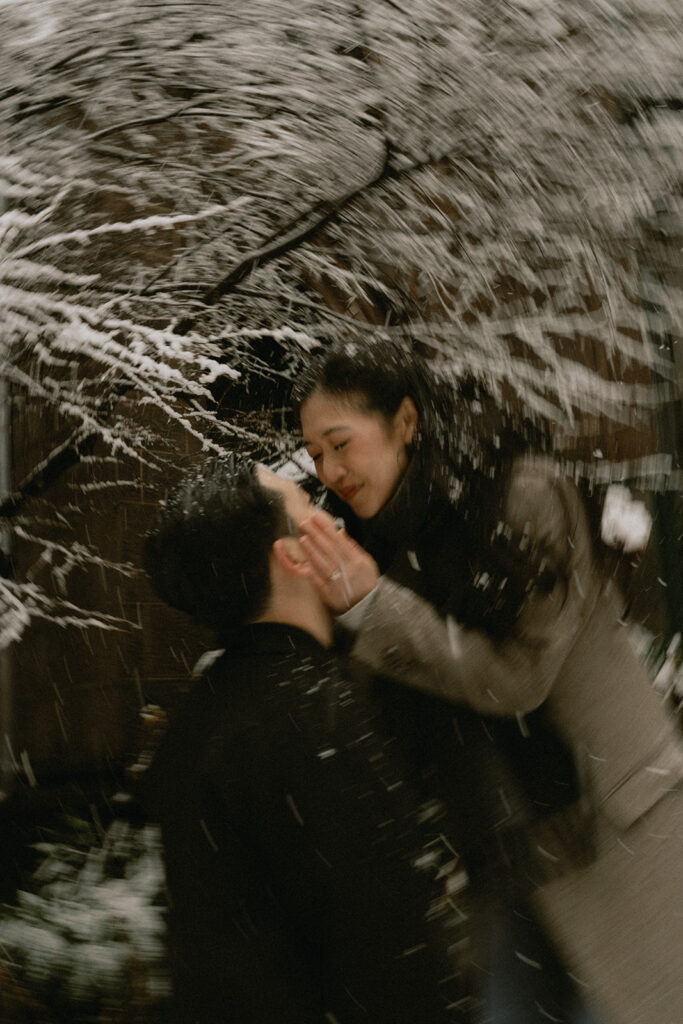 Snowy engagement photos in New York City with a cinematic style.